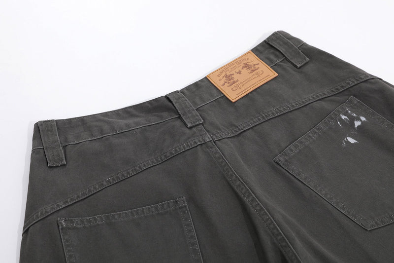 Black shorts back waistband close-up with leather label and topstitching
