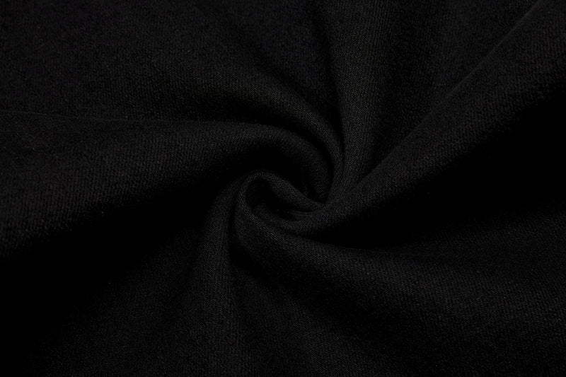 Close-up of black fabric texture with soft draped folds
