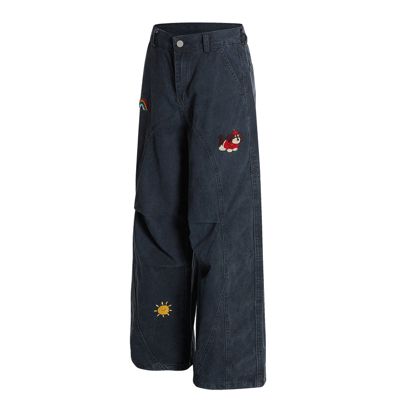 Navy wide-leg pants angled front view with rainbow, dog and sun embroidery
