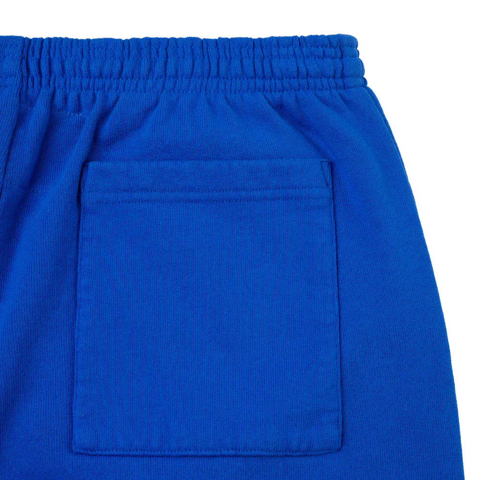 Close-up of the upper part of 100% Cotton Sp5der Sweatpants—Unisex Blue Jogger Pants with a pink logo, star accents, elastic waistband, and hip patch pocket—ideal for streetwear lovers seeking a relaxed fit.