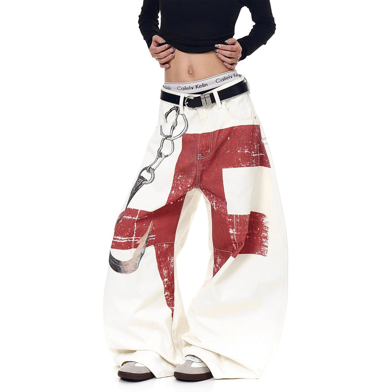 Model wearing cream barrel jeans with red block print and chain graphic, front view