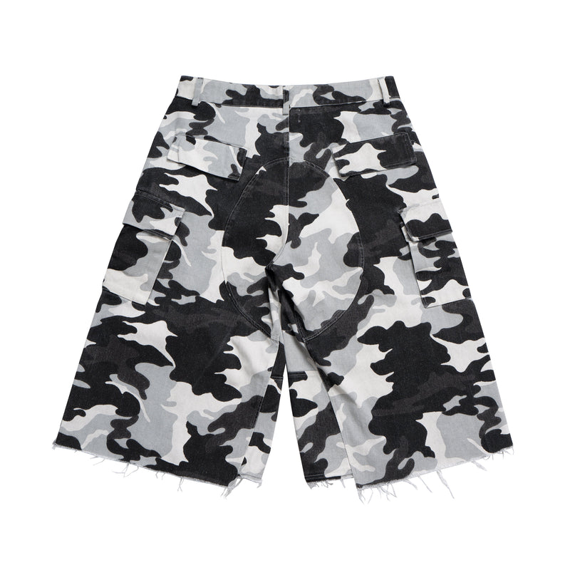 Black, white, and gray camo cargo shorts with wide legs and frayed hems, front view