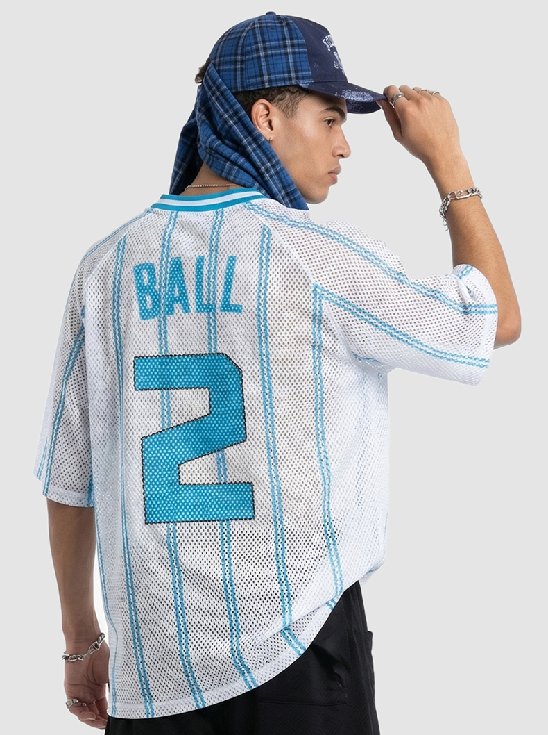 Back view of a white and blue mesh jersey T-shirt with Ball #2 print, styled with a blue plaid cap and streetwear look