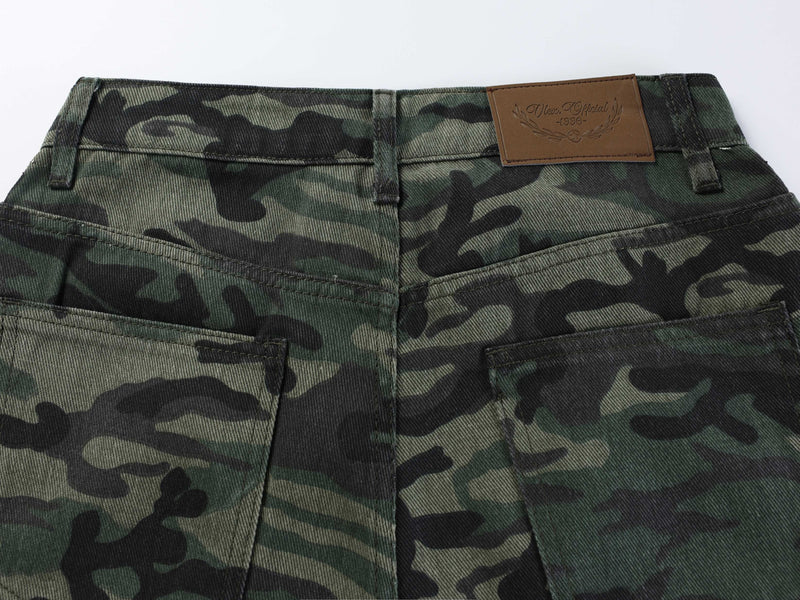 Back waistband close-up of camouflage jeans with brown label and seam details