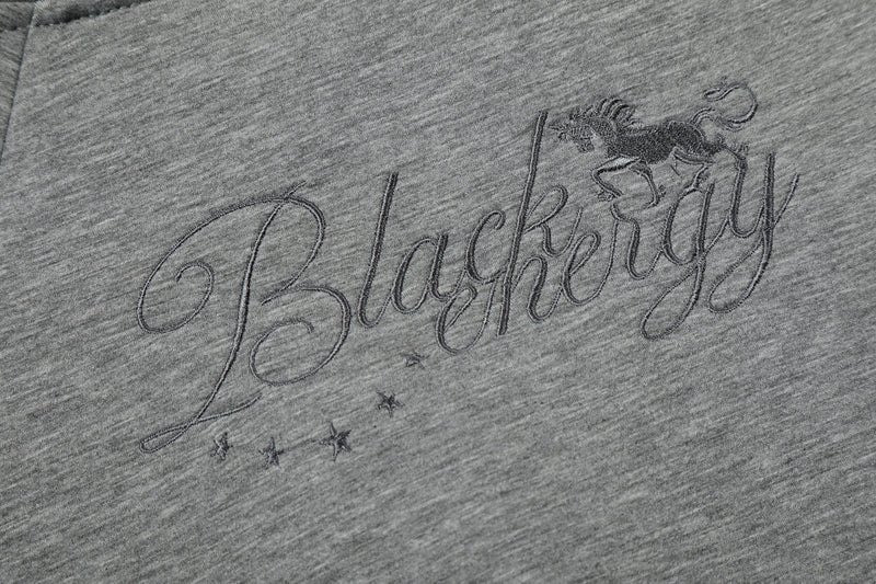 Close-up of embroidered script on grey hoodie back