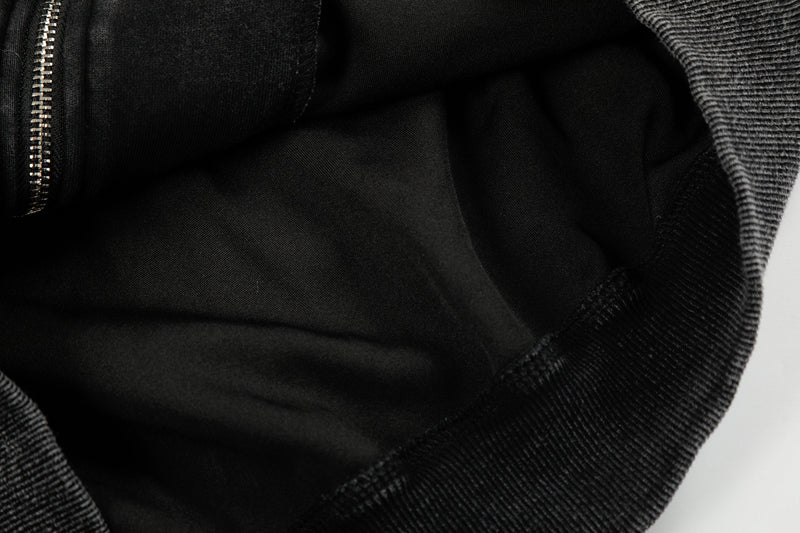 Close-up of black hoodie hood lining and inner front seam near the zipper