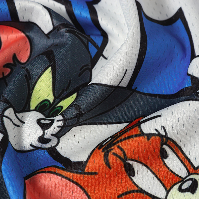 Close-up of a Tom and Jerry football jersey graphic with Jerry and Tom in bold blue, orange, and white streetwear colors