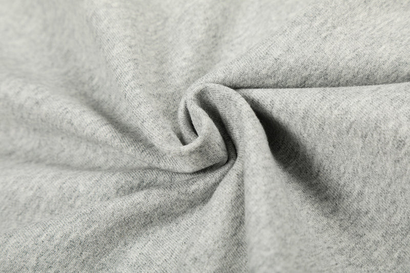 Close-up of light gray hoodie fabric texture and fold