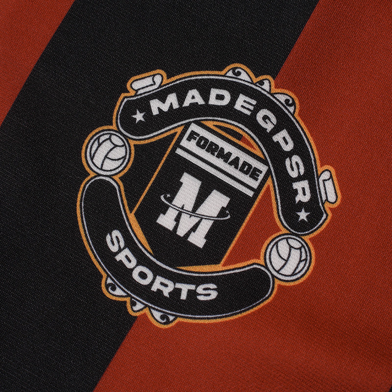 Black and orange striped football jersey fabric with Made GDSR sports crest and bold center logo