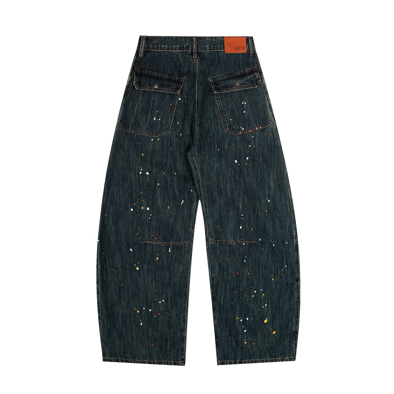Dark wash wide-leg jeans with paint splatter, back view with pockets and logo patch