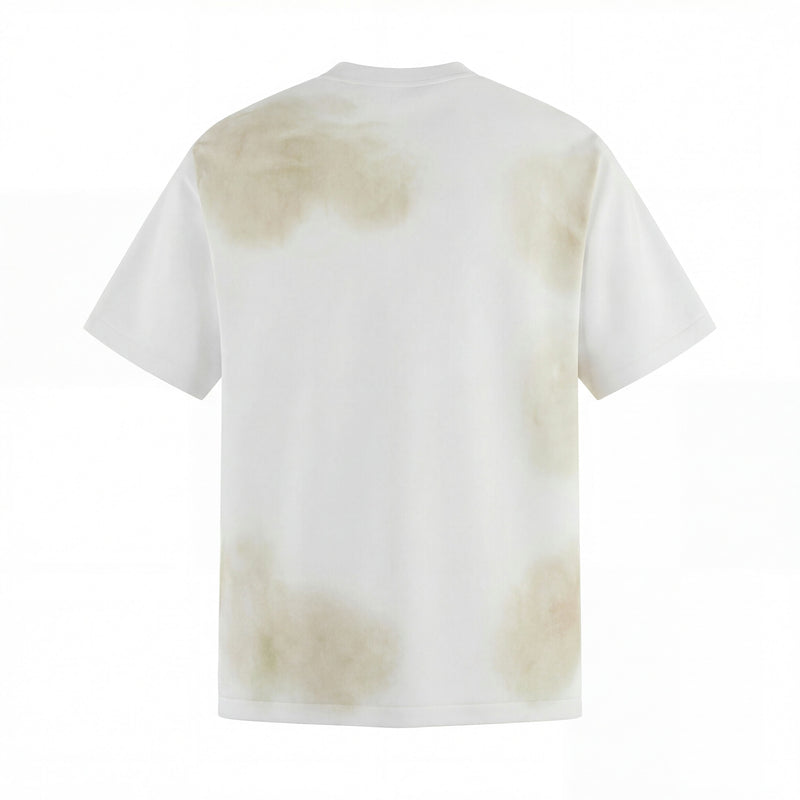 White washed distressed graphic tee with faded beige tie-dye accents, streetwear style, back view