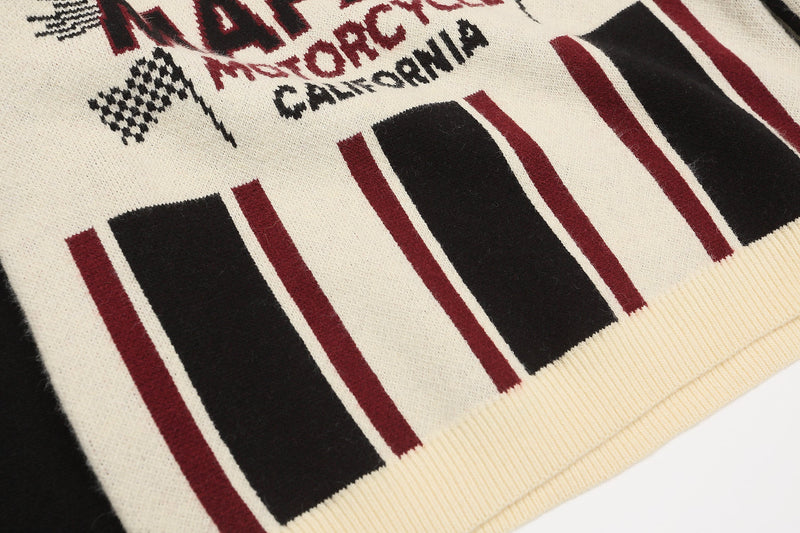 Close-up of lower front hem on striped knit sweater with burgundy and black blocks
