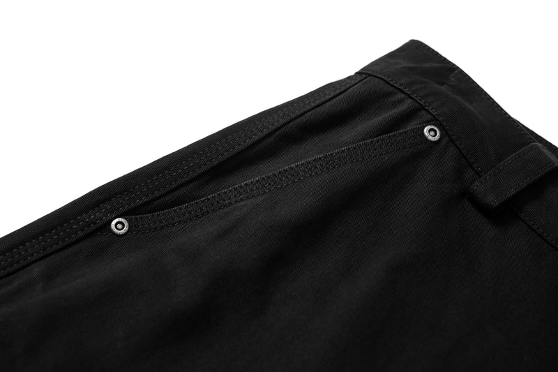 Close-up of back waistband with belt loop and snap detail on black cargo pants
