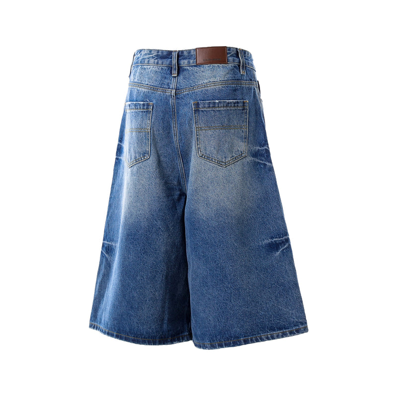 Dark wash denim shorts back view showing wide legs and rear patch pockets