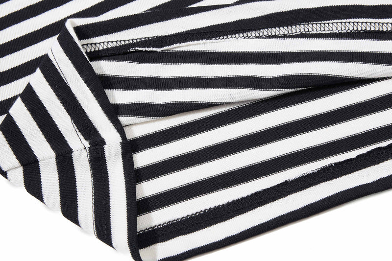 Black and white striped knit tee fabric with raw stitched seams and ribbed trim, shown in a close-up streetwear detail shot