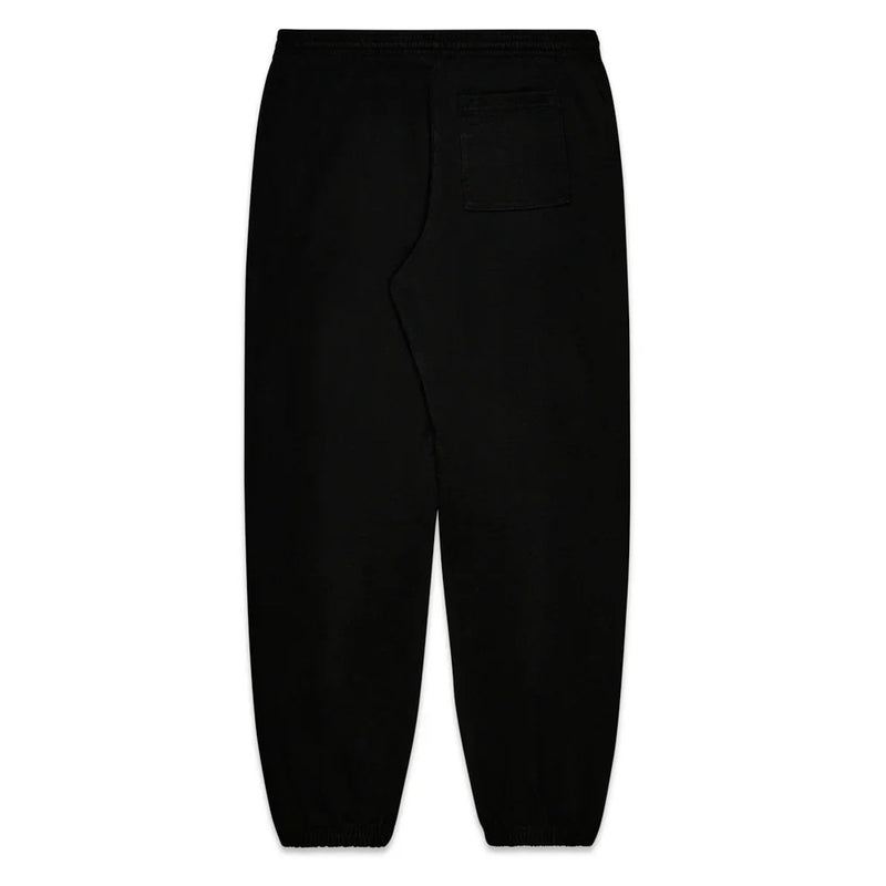 The Sp5der Sweatpants are unisex black cotton joggers with pink graphic logo and star print, elastic cuffs and waistband, a soft casual feel, and a single right patch pocket shown from the back.