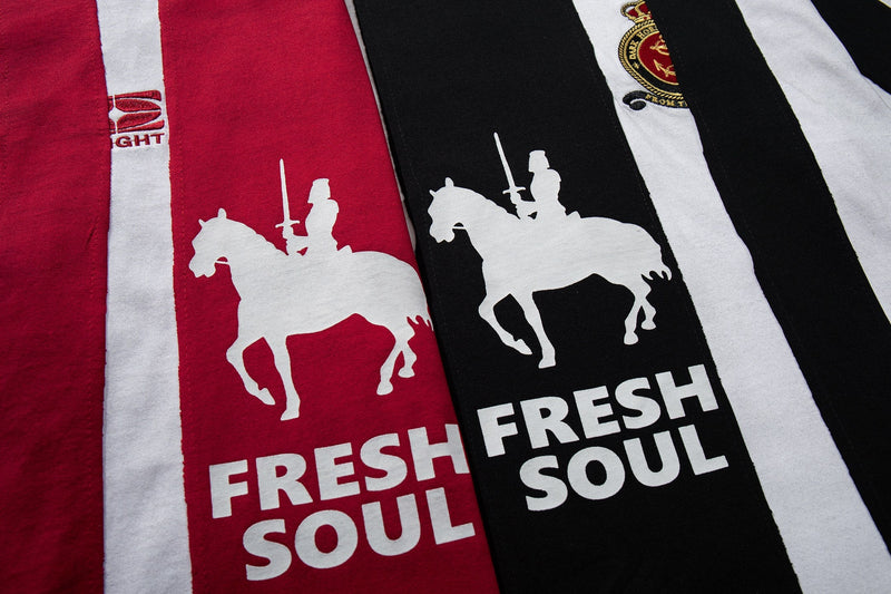 Striped red and black football jersey tee with white knight graphics and Fresh Soul streetwear lettering