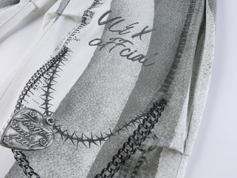 Close-up of printed graphic panel with chain and script details
