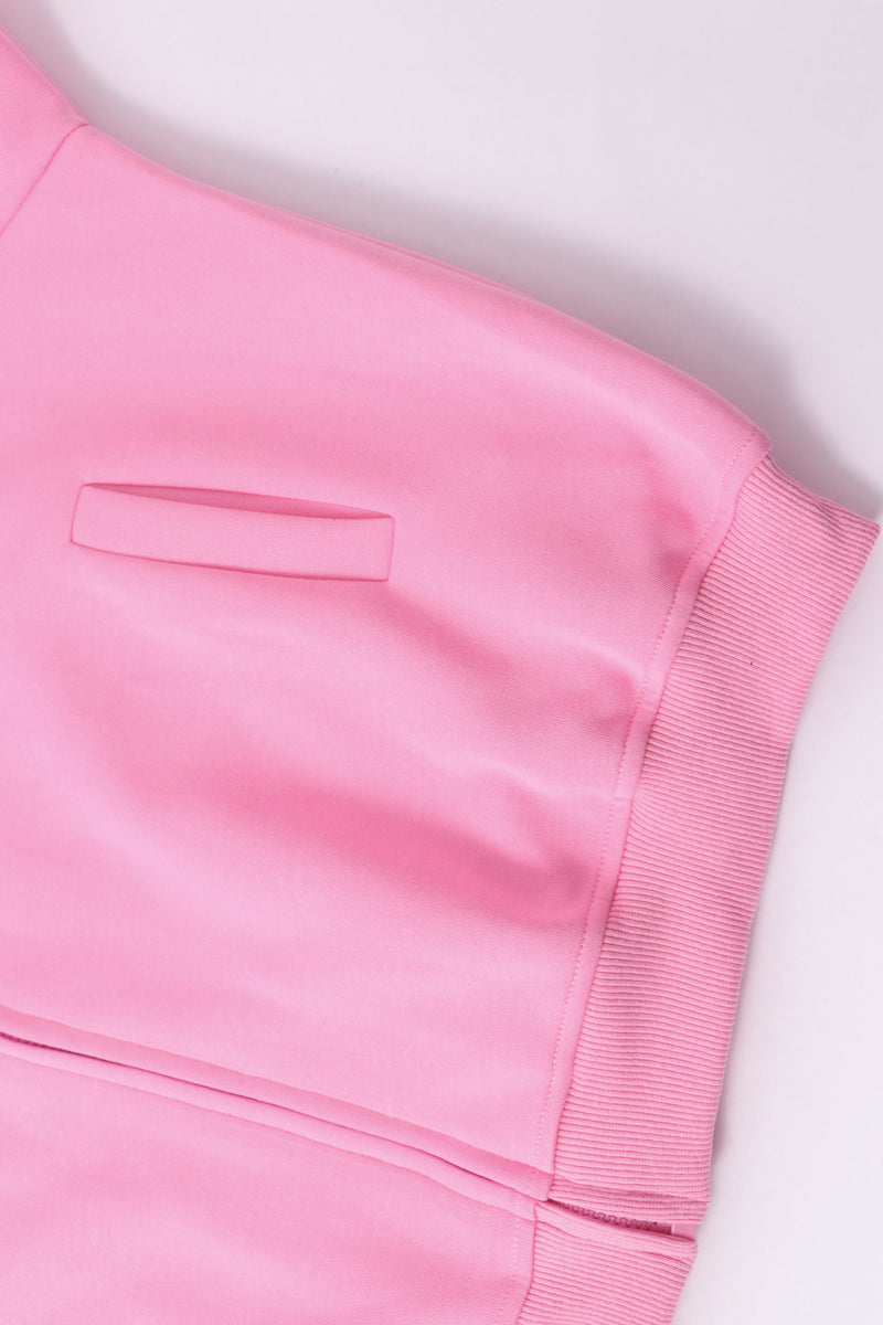 Pastel pink hoodie sleeve and ribbed cuff with pocket detail close-up