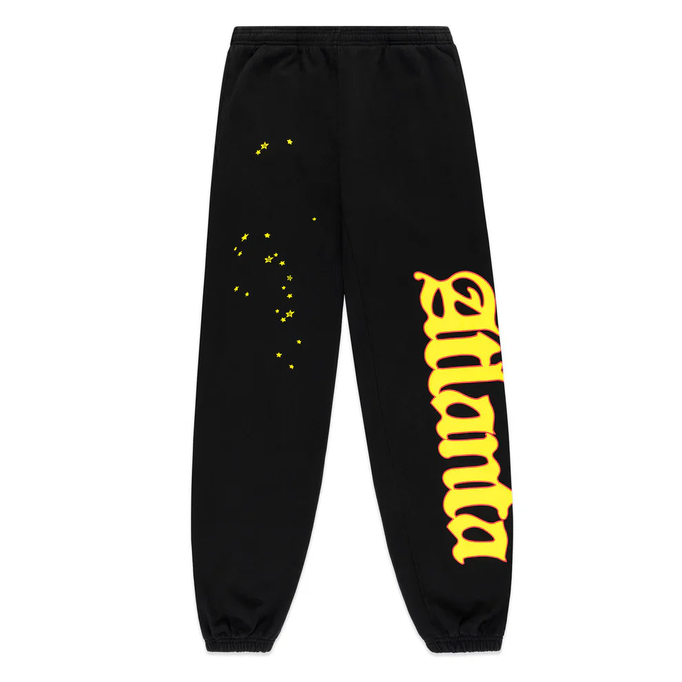 Unisex Sp5der Sweatpants in black cotton feature a bold flame side logo and star print, blending standout streetwear style with signature Sp5der details for a striking look.