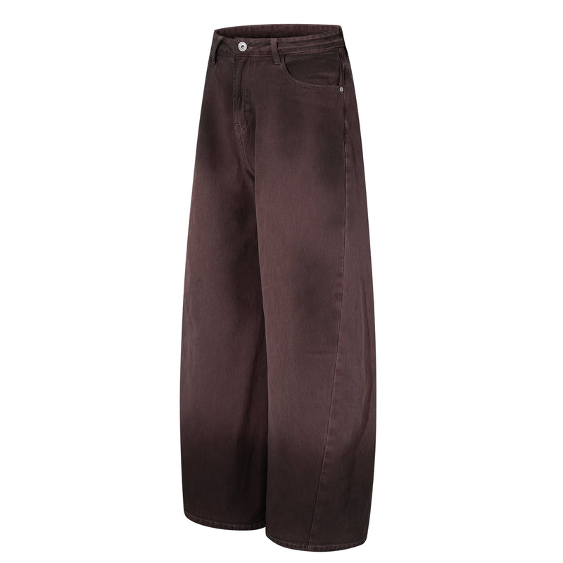 Three-quarter front view of brown wide-leg jeans with gradient wash and oversized fit