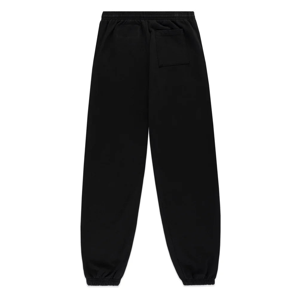 The Sp5der Sweatpants – Unisex Black Cotton Sweatpants feature a flame side logo, star print, elastic waistband and cuffs, a single right back pocket, and classic jogger style shown from the back.
