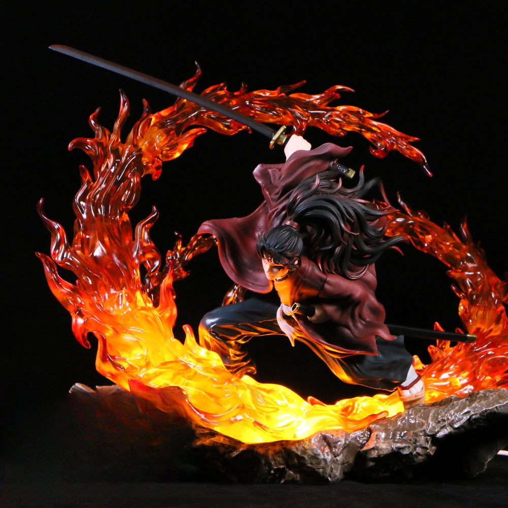 The Tsugikuni Yoriichi Demon Slayer Figure is a 29cm Premium PVC statue from the Demon Slayer brand. It depicts the warrior in a crouched pose with flowing hair, wielding a sword surrounded by swirling flame effects, accented with vivid orange and red, showcasing the Breath of the Sun technique.