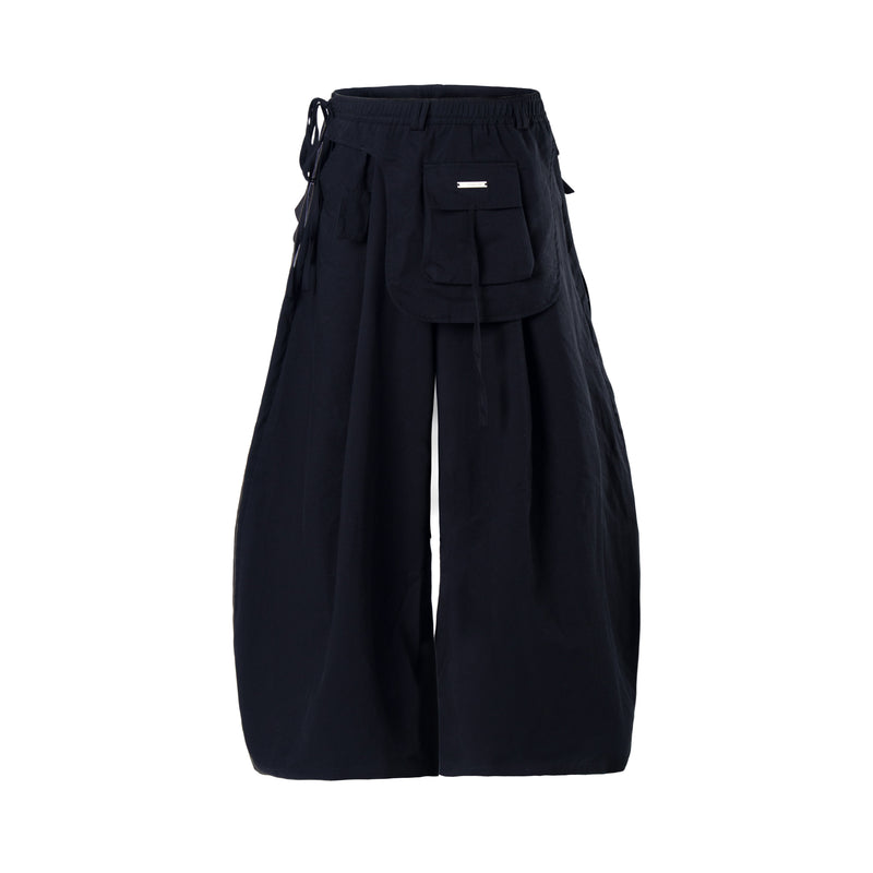 Black wide-leg cargo pants front view with multiple flap pockets and tie waist