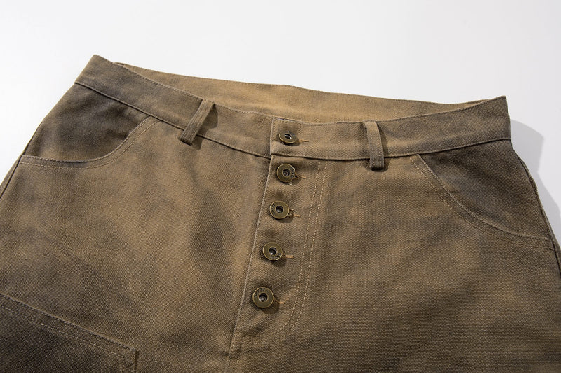 Close-up of front waistband and button fly on olive brown washed cargo shorts
