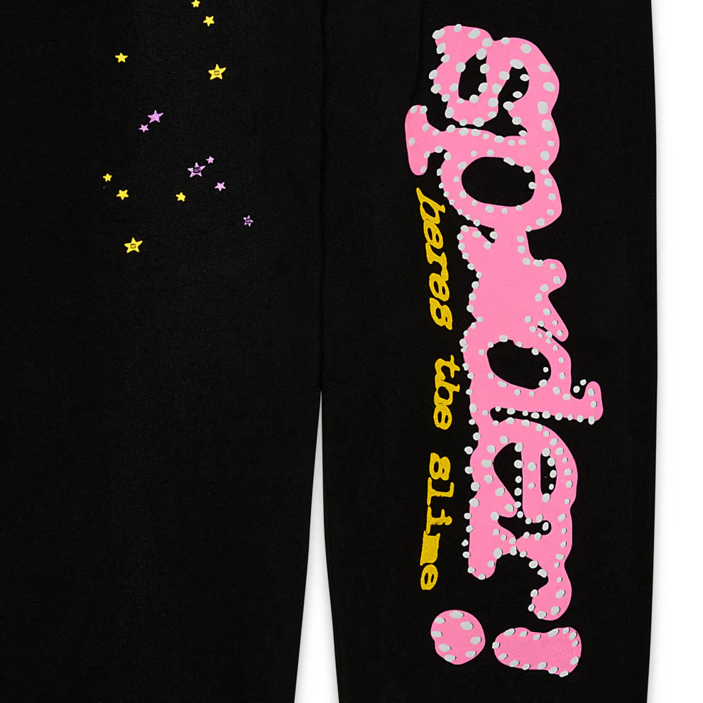 Sp5der Sweatpants – Unisex black cotton sweatpants with a bold pink Sp5der! graphic logo, “beware the slime” in yellow, and pink and yellow star prints for added flair.