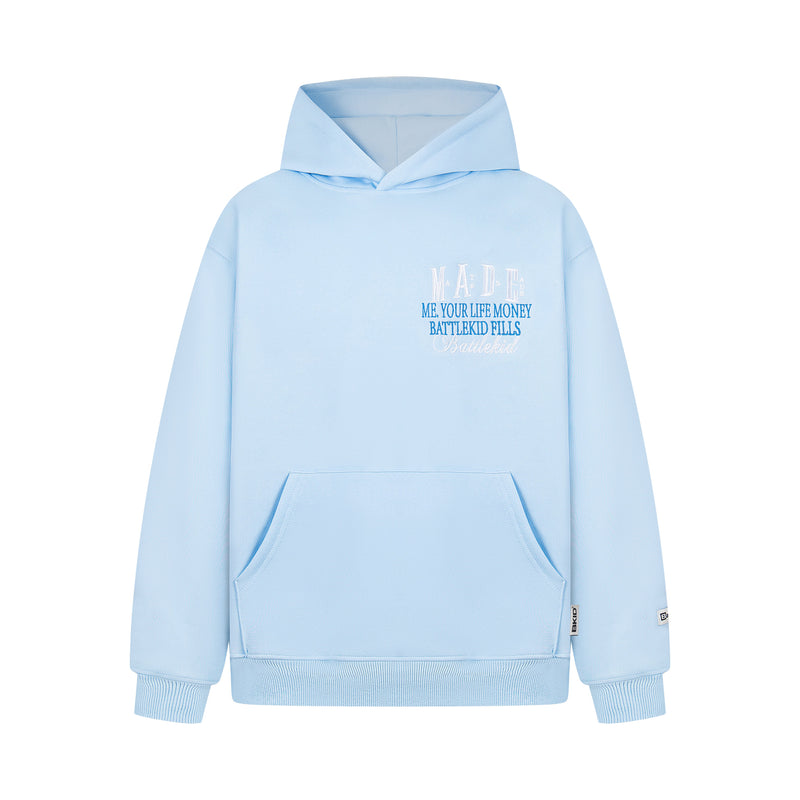 Light blue hoodie front view with small white and blue embroidered MADE badge logo