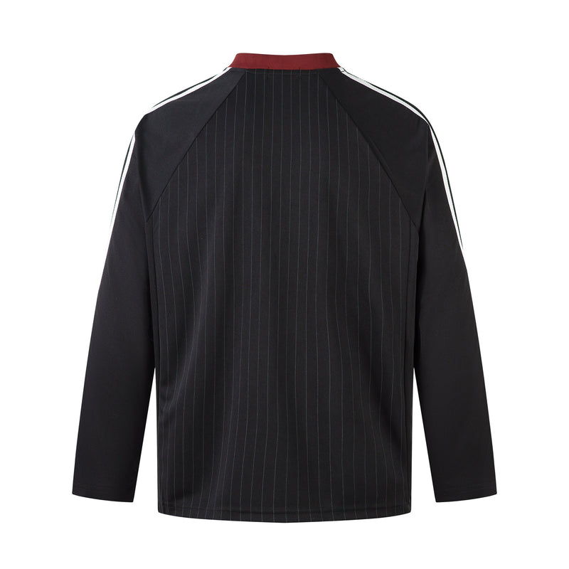 Back view of black long-sleeve football jersey with thin pinstripes and red collar