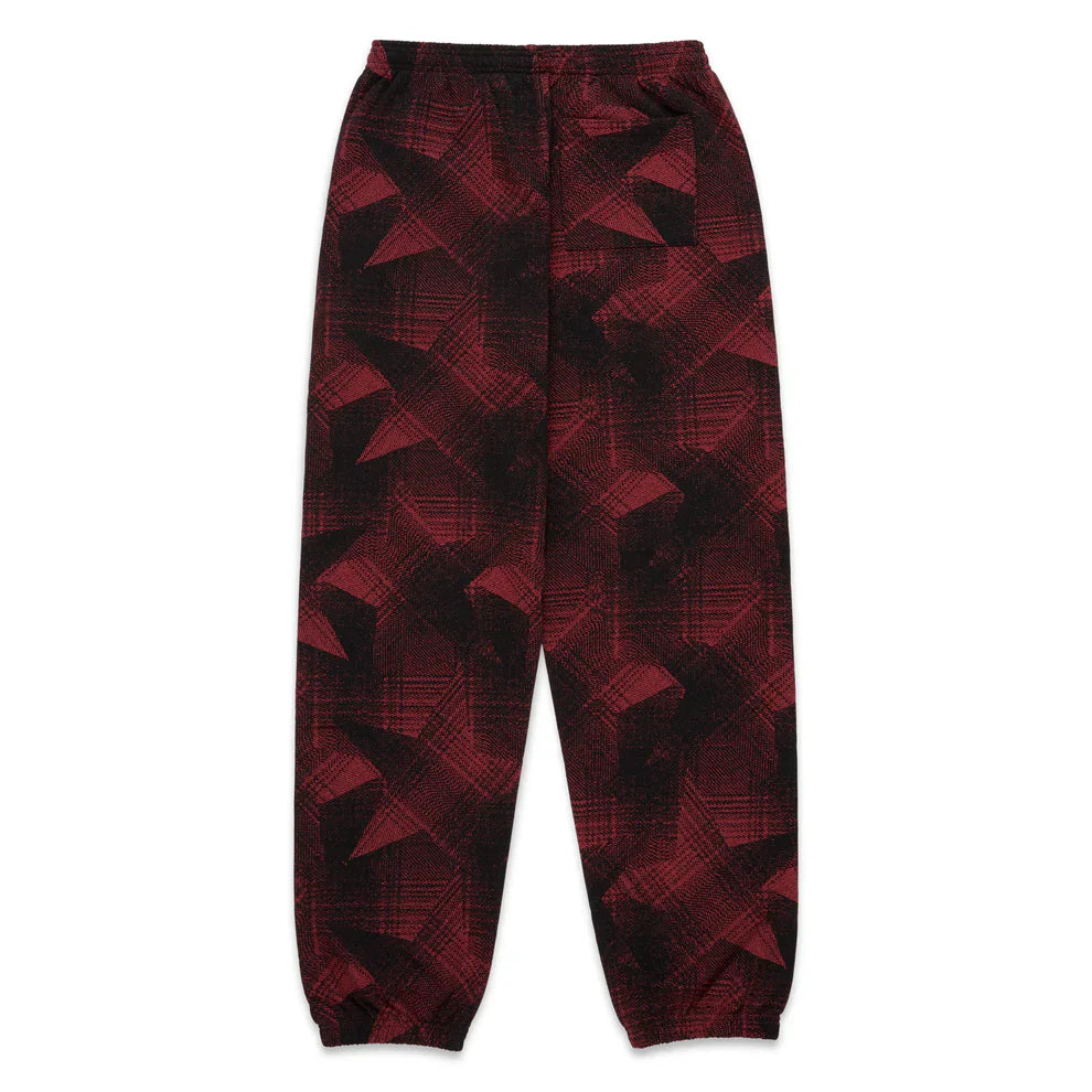 Sp5der Sweatpants – Unisex red and black patterned cotton sweatpants with graphic detail, an elastic waistband, and ankle cuffs, shown laid flat on a white background.
