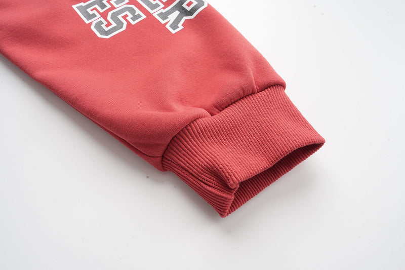 Red ribbed sleeve cuff on zip hoodie