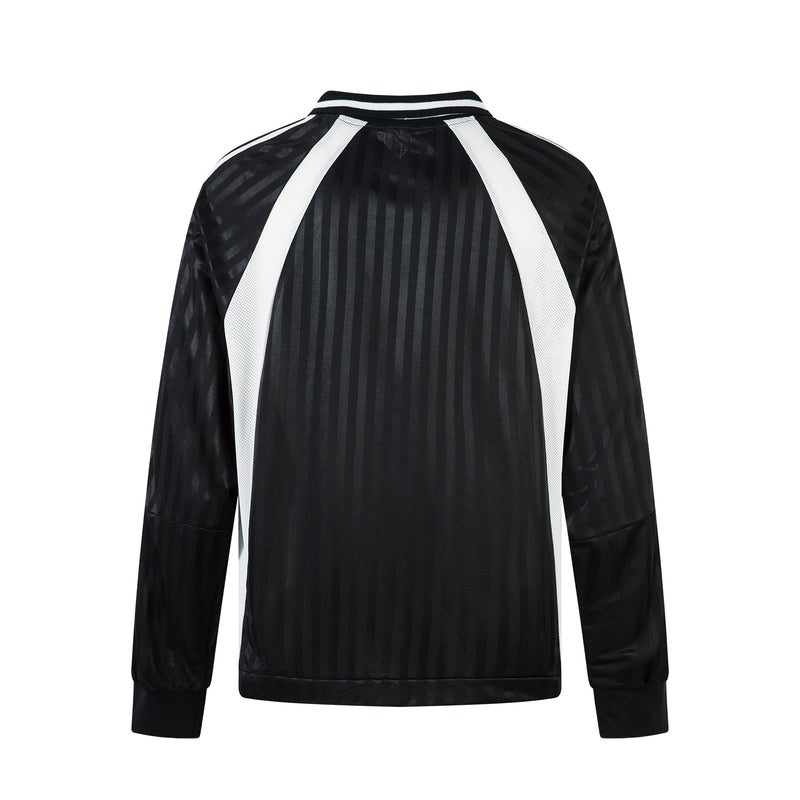 Back view of black long-sleeve football jersey with white side panels and striped collar