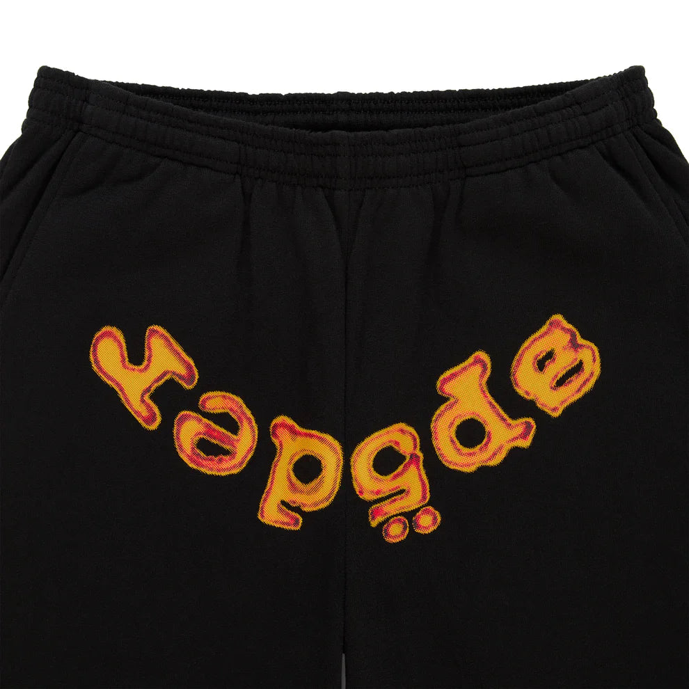 Sp5der Sweatpants – Unisex black cotton sweatpants with an elastic waistband and an upside-down yellow and red flame logo printed across the front.