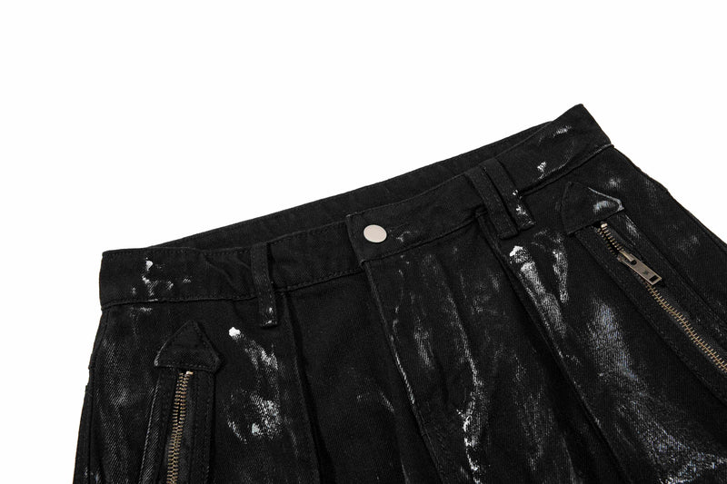 Close-up of black waistband with metal snap button and side zipper pocket