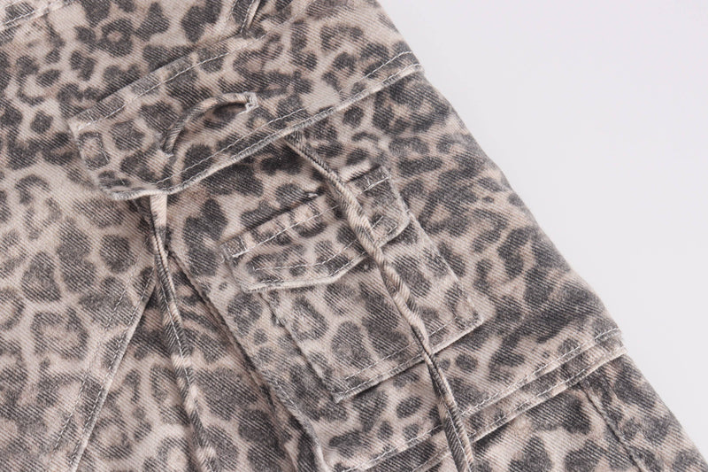 Close-up of side cargo pocket on leopard print wide-leg jeans