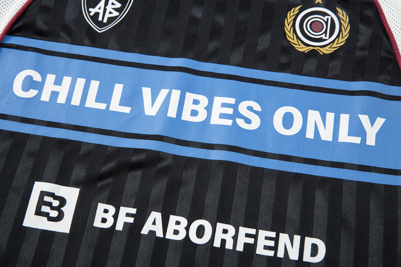 Front close-up of CHILL VIBES ONLY slogan and BF ABORFEND logo on black jersey