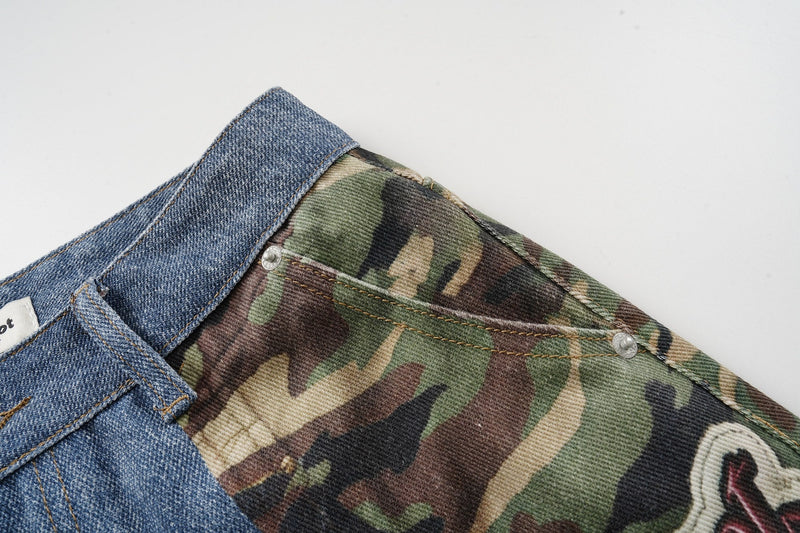 Close-up of camouflage panel meeting blue denim at the back waist seam