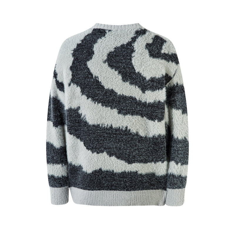 Back view of oversized crew neck sweater with black and white zebra print and fluffy knit texture