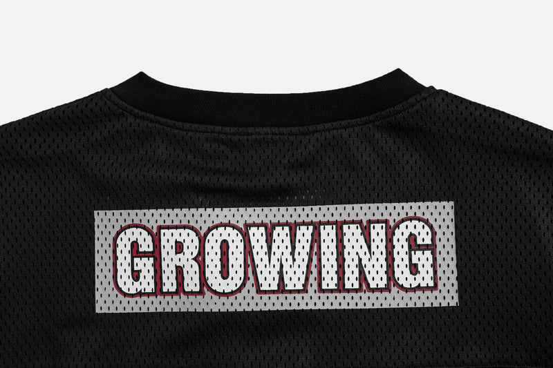 Black mesh collar with white GROWING patch and red outlined lettering