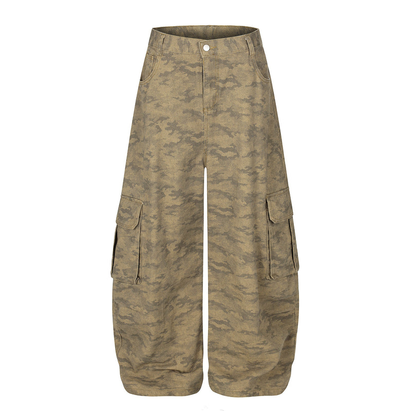 Front view of desert camo wide-leg cargo jeans with flap pockets and button waist