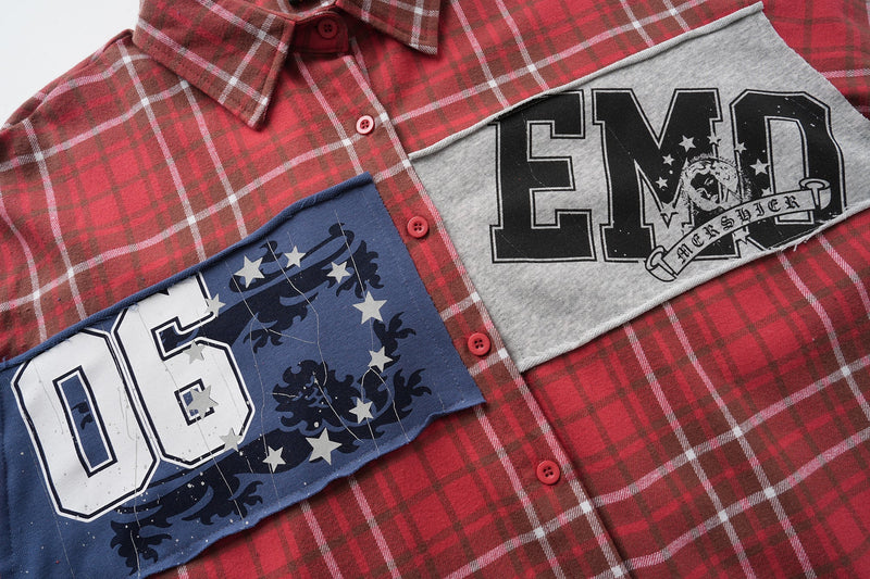 Chest panel detail on red plaid flannel shirt with gray and blue graphic patches