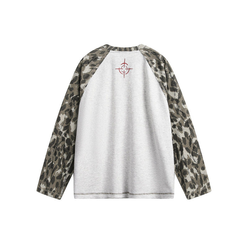 Back view of white raglan long sleeve T-shirt with camouflage sleeves and small red neckline graphic