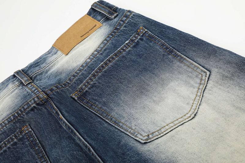 Close-up of back waistband and patch label on vintage wash denim jeans