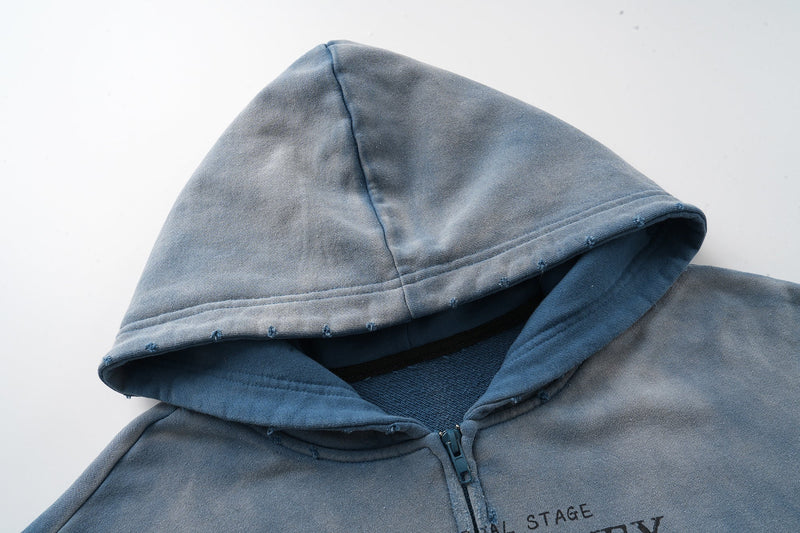 Close-up of blue hoodie hood with faded vintage wash and stitched edge details