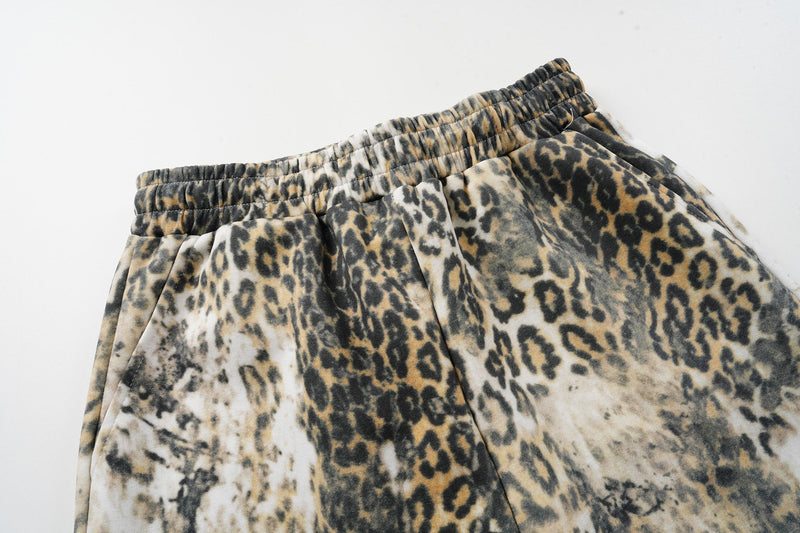 Close-up of elastic waistband and front pleats on leopard print pants