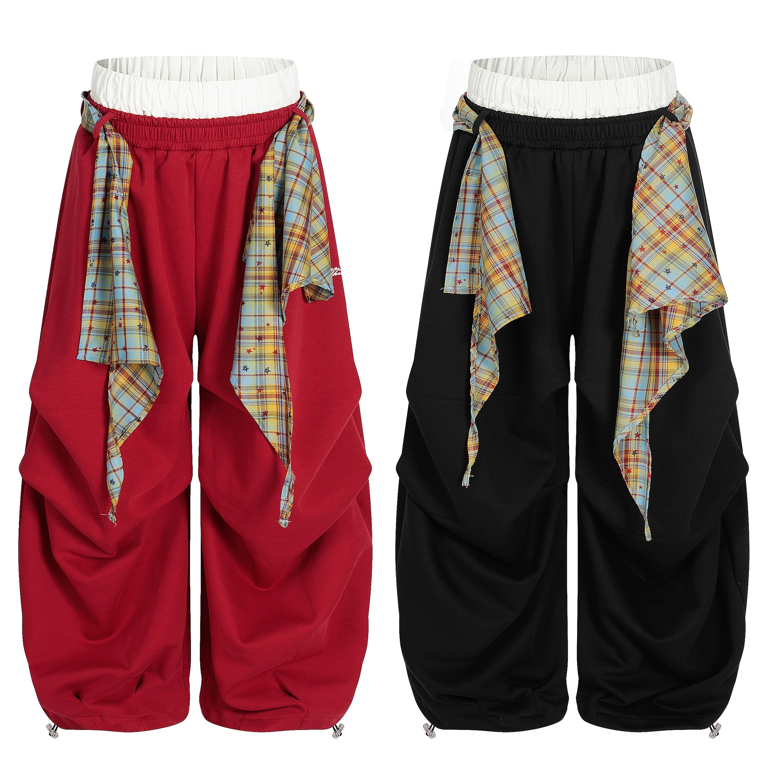 Red and black wide-leg stacked pants with blue and yellow plaid drape scarf panels tied at the elastic waistband