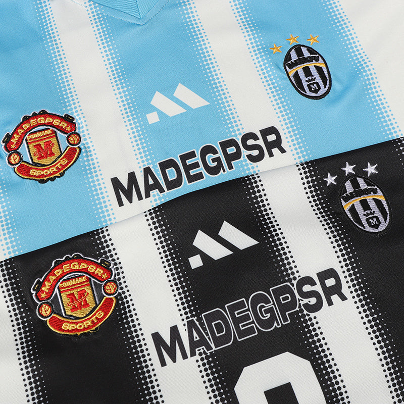 Vertical striped football jersey in light blue and black, featuring club-style crest patches and MADEGPSR branding